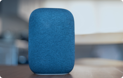 Blue speaker used to play audio gathered from speech to text